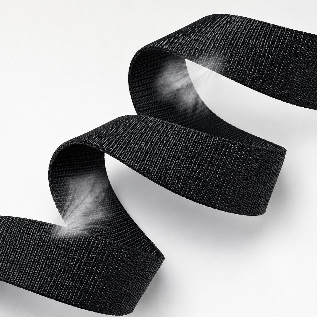 The woven nylon strap of The Ratchet Belt folded to show the weave