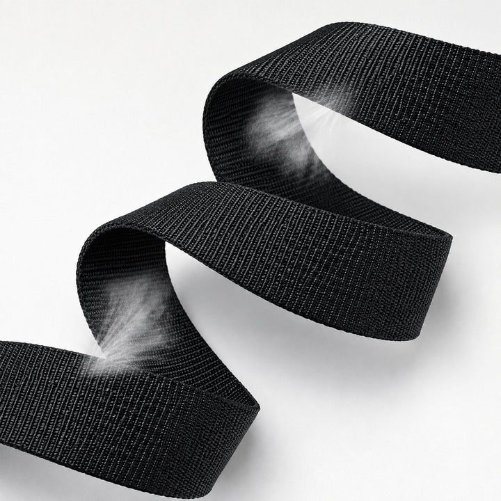 The woven nylon strap of The Ratchet Belt folded to show the weave