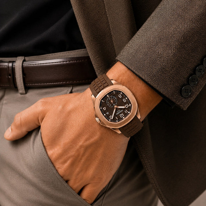 The Cushion Watch worn on the wrist with a hand in a trouser pocket