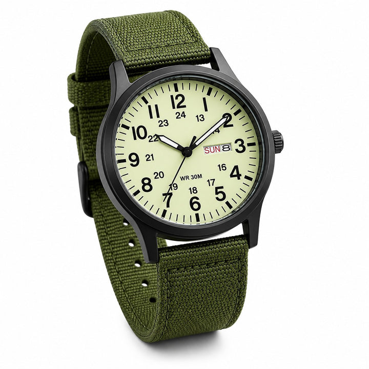 The Field Watch, black case and full lume dial on a green nylon strap, on a white background