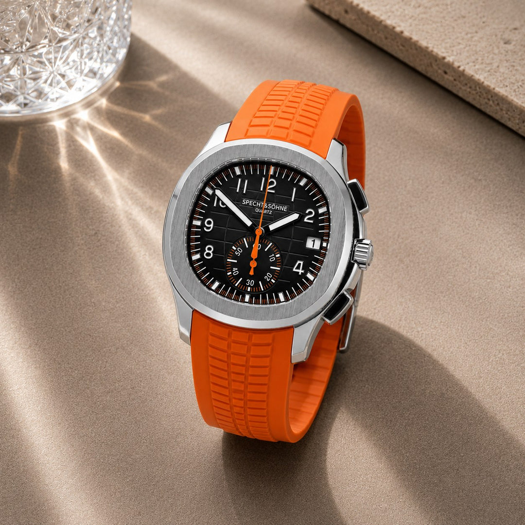 The Sport Chronograph resting on a stone surface in daylight