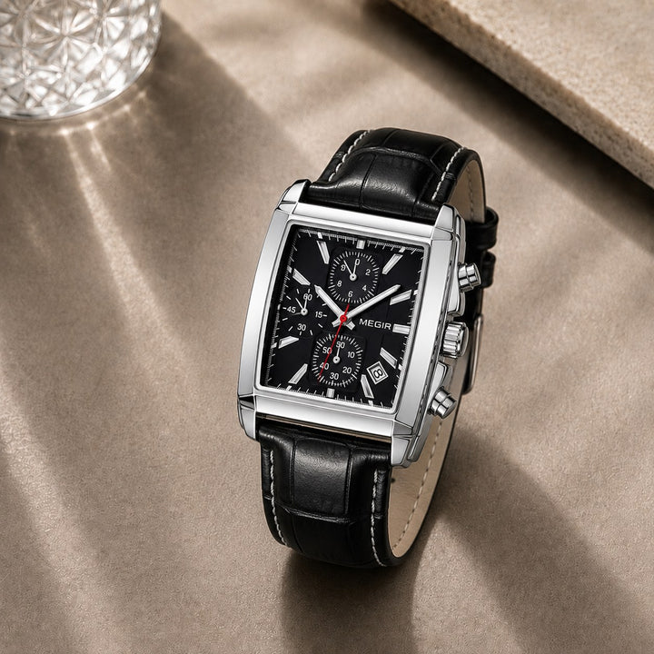 The Tonneau Chronograph resting on a stone surface in daylight