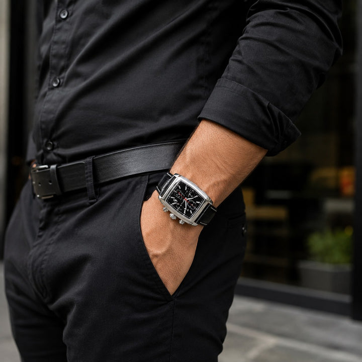 The Tonneau Chronograph worn on the wrist with a hand in a trouser pocket